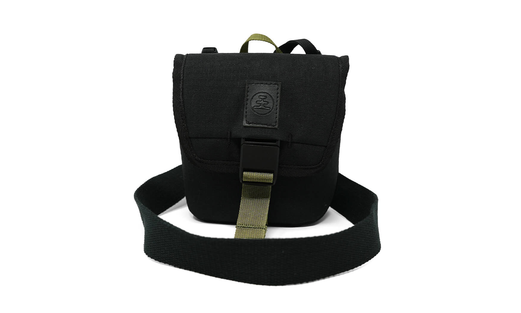 Small black canvas field pouch with buckle closure, shoulder strap, and olive accent details, front view