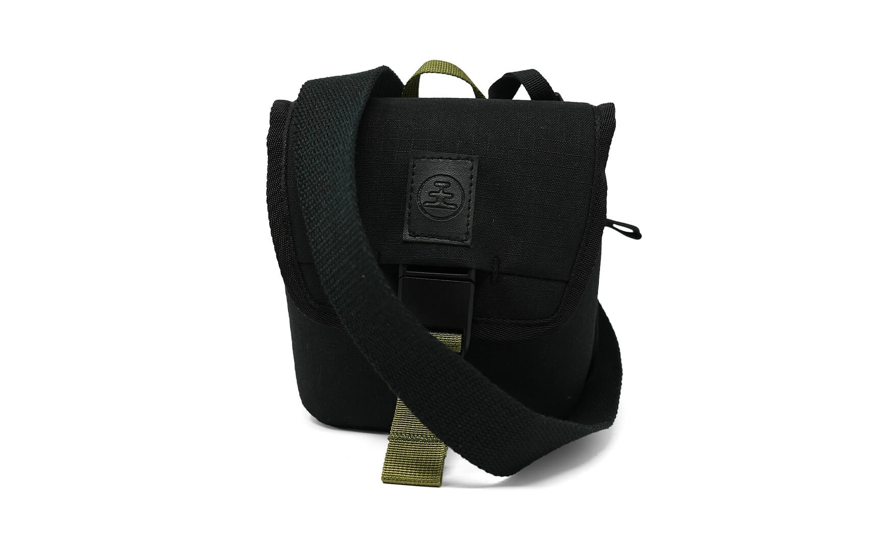 Small black canvas crossbody pouch with olive green strap, buckle closure, and logo patch, front view