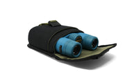 Black compact binocular pouch open showing blue binoculars inside, top view