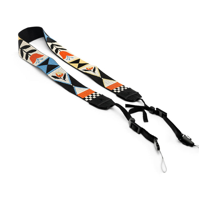 Woven tapestry camera strap with colorful geometric and floral pattern, black adjustable ends with clips