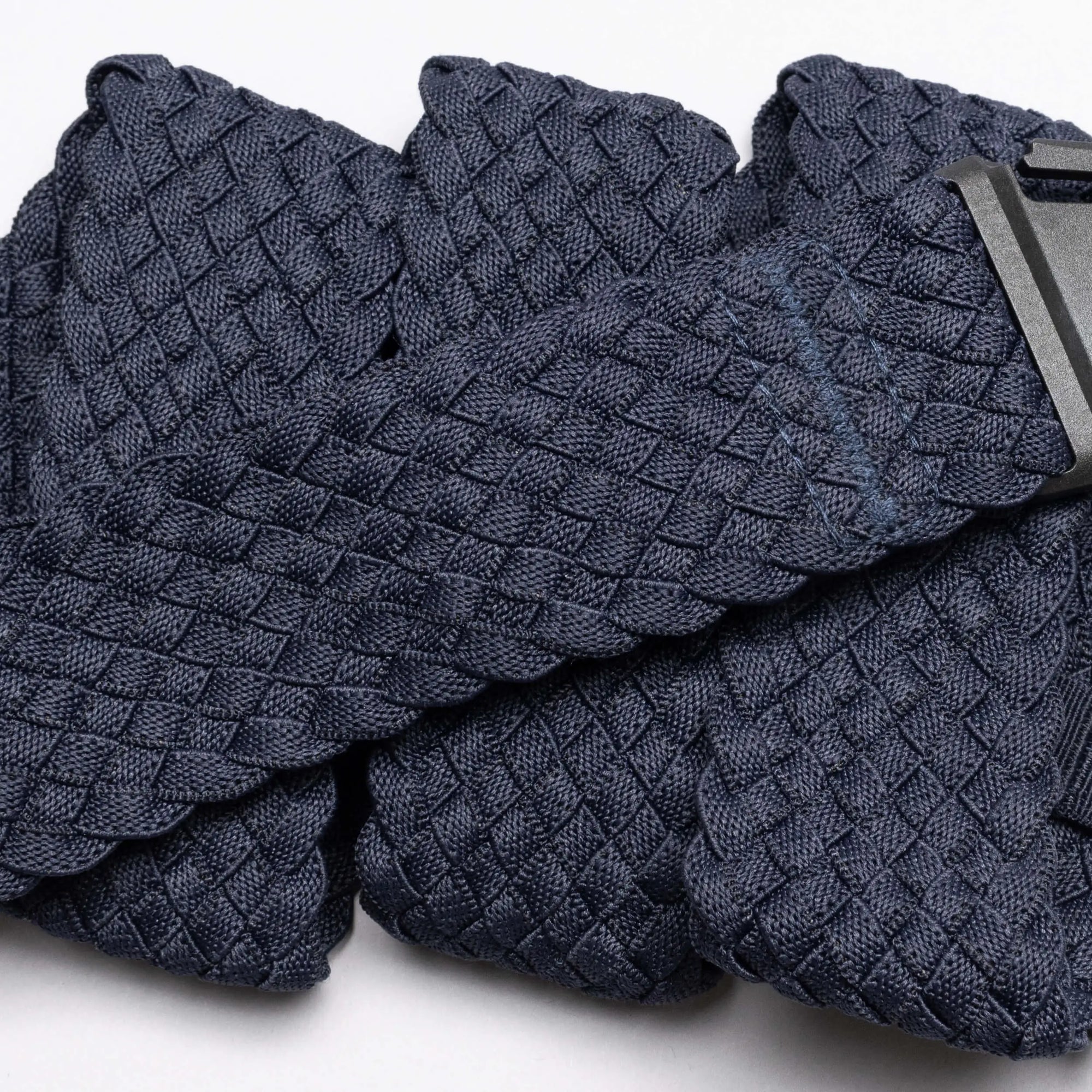 Woven fabric belt with diamond basketweave pattern and metal buckle clasp