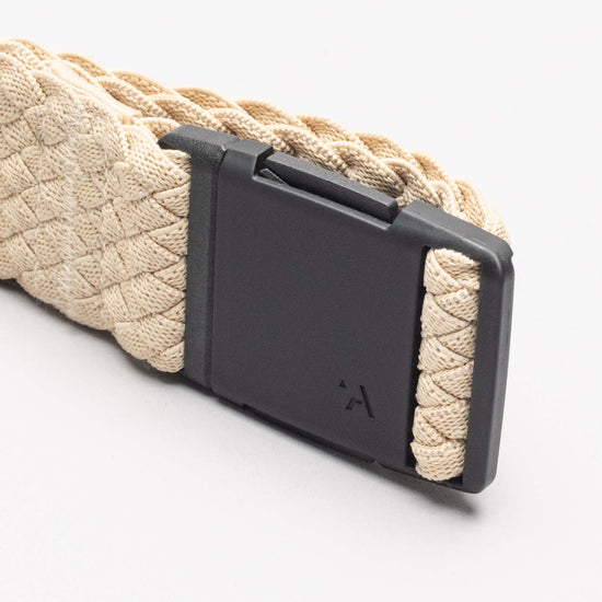 Woven rope belt with black plastic buckle featuring release mechanism, close-up detail view
