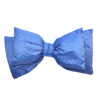 Oversized puffer bow accessory in medium blue, front view on white background