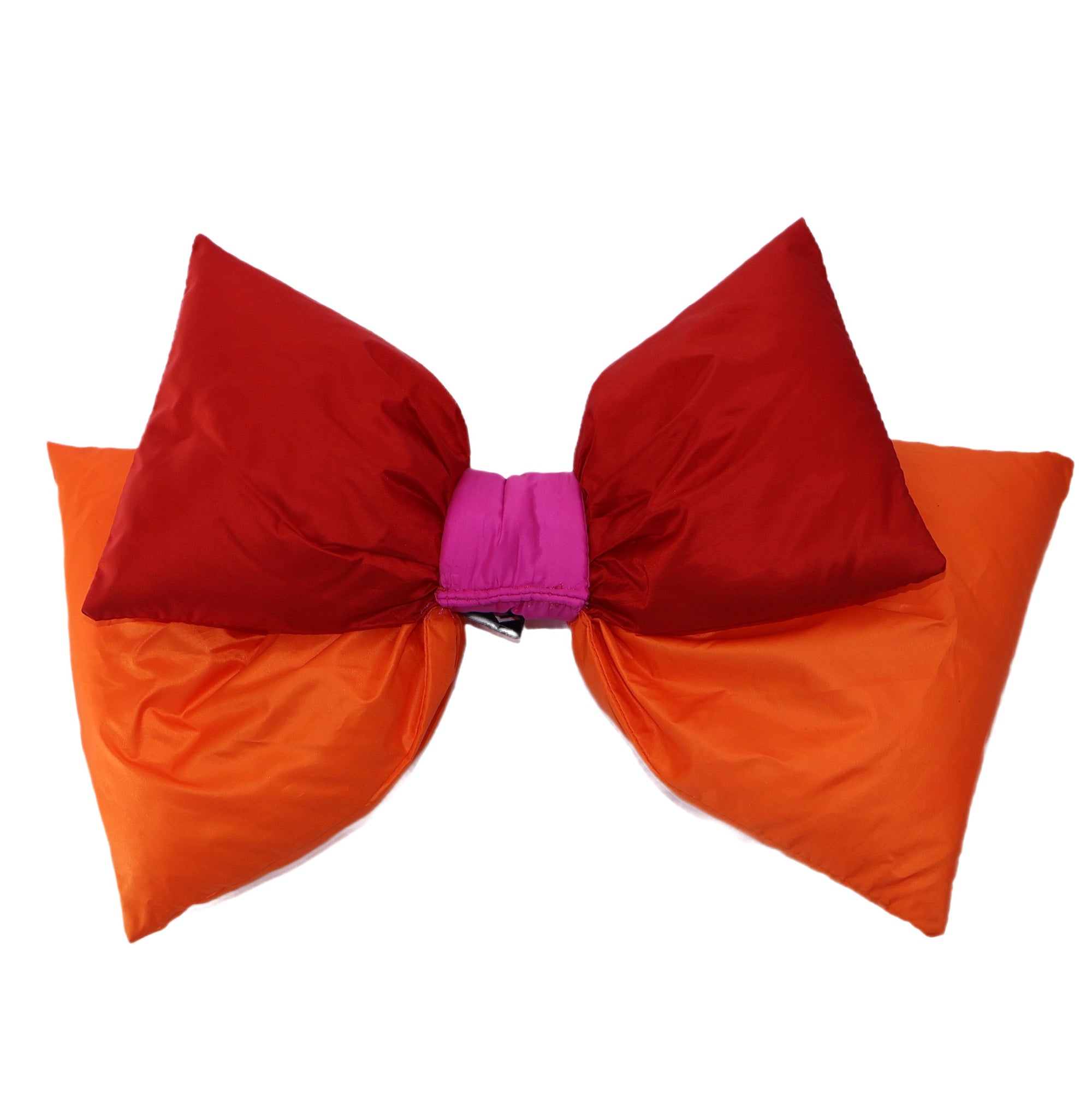Oversized puffy ski helmet bow in red and orange with fuchsia center knot, studio view