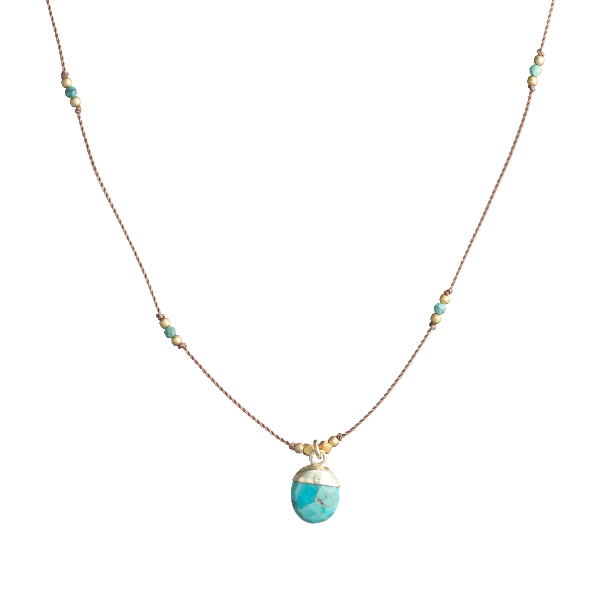 Delicate cord necklace with turquoise stone pendant, gold cap, and small scattered beads