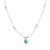 Delicate cord necklace with turquoise stone pendant, gold cap, and small scattered beads