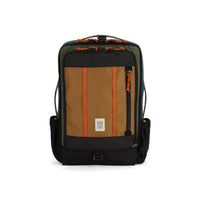 Large travel backpack with tan front panel, olive sides, black base, and orange zipper pulls, front view