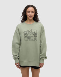 Light green crew neck sweatshirt with black line drawing of potted plants