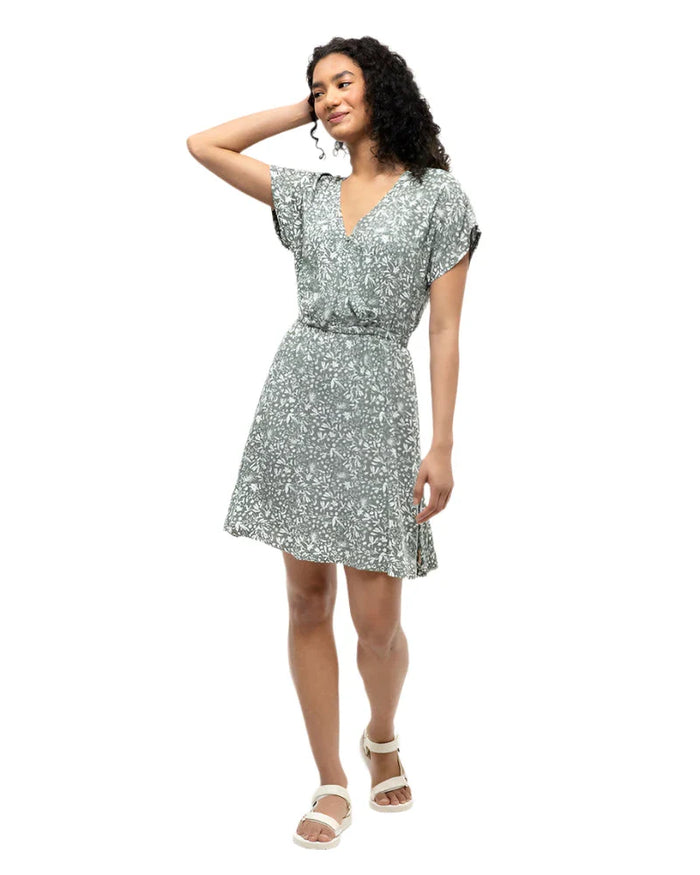 Sage green wrap dress with floral print, short sleeves, V-neck, and belted waist on model
