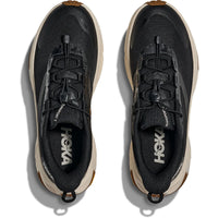 Black athletic running shoes with toggle lacing system and tan midsole, top-down view