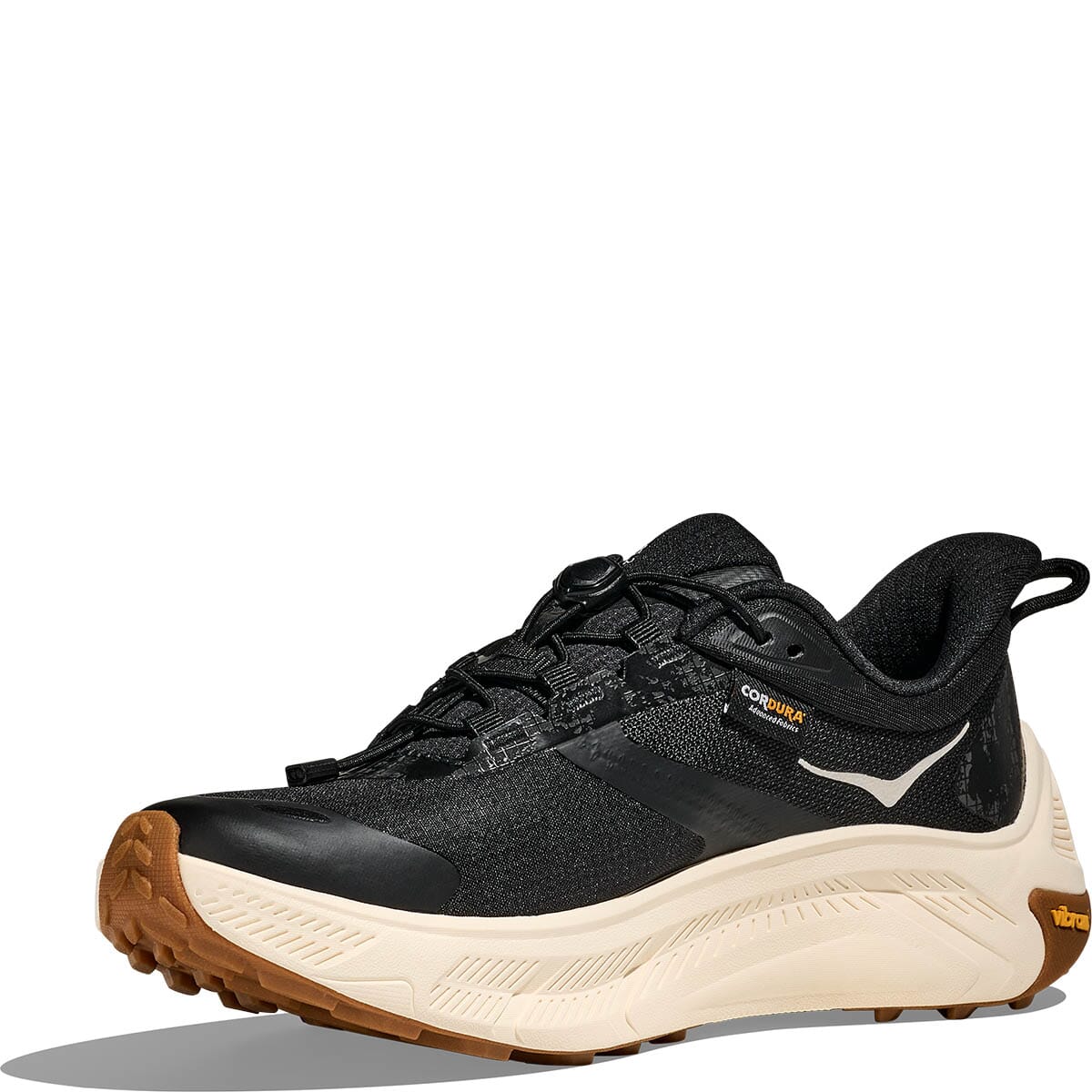 Black athletic running shoe with cream midsole and brown rubber outsole, side profile view