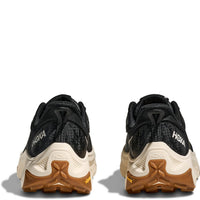 Black athletic running shoes with cream midsole and brown outsole, rear heel view
