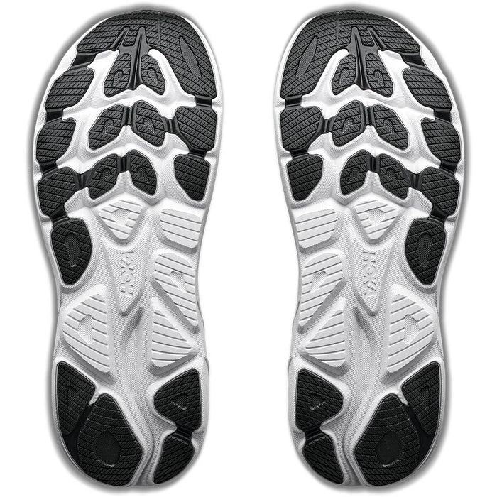 Bottom view of running shoe pair showing white and black segmented outsole with traction pods
