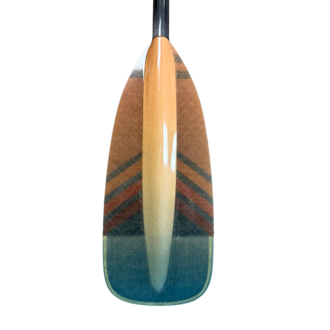 Wooden canoe paddle with geometric chevron pattern in teal and orange tones