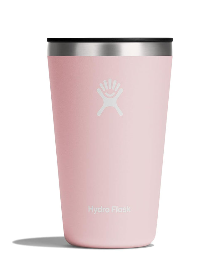 Light pink insulated tumbler with black lid and white logo, front view