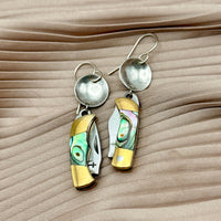 Dangle earrings featuring miniature pocket knives with abalone shell inlay and silver disc tops