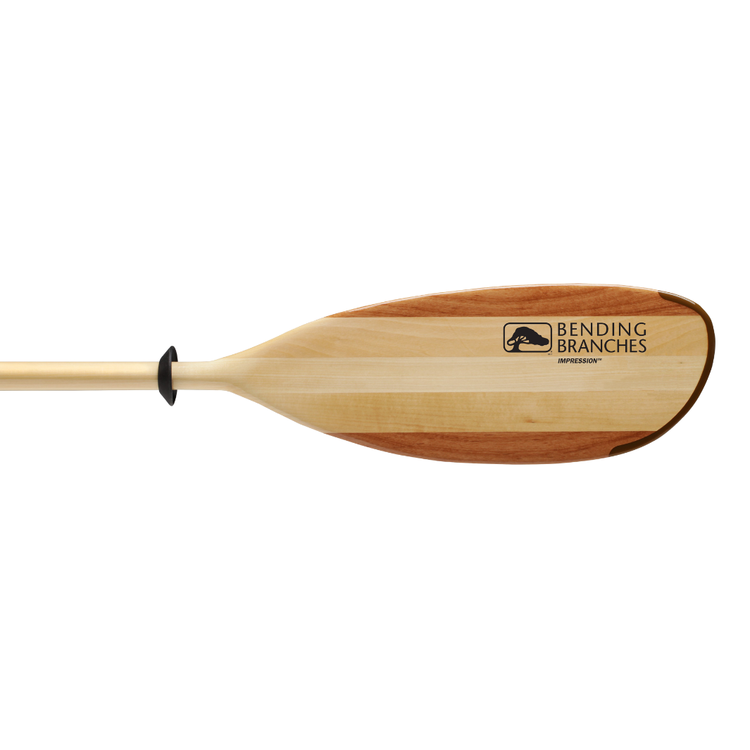 Wooden kayak paddle with natural wood grain blade and shaft on white background
