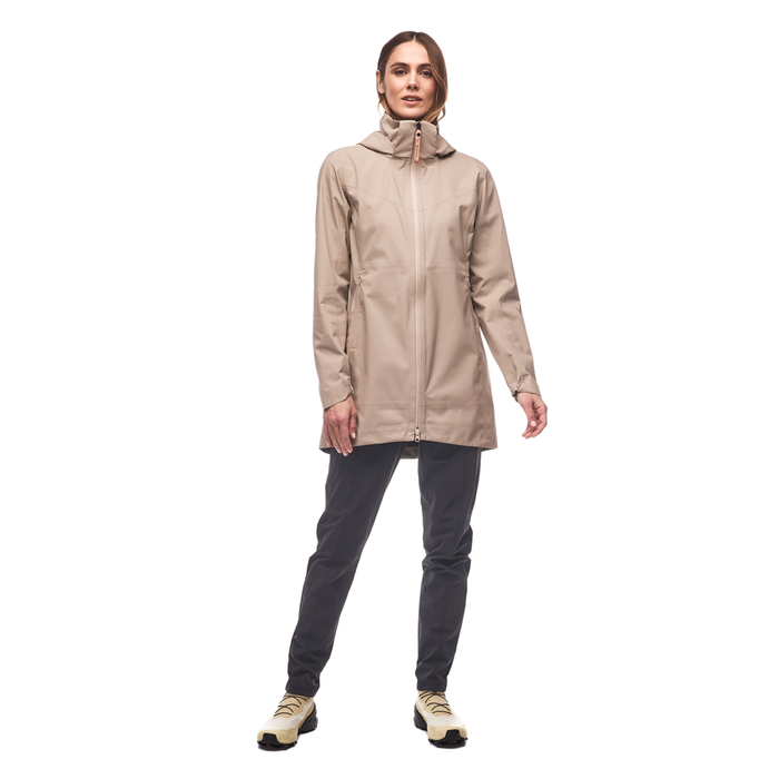 Light beige hooded jacket with full zip closure worn over dark pants