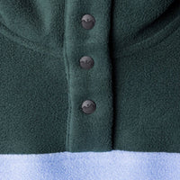Dark green fleece jacket detail showing three decorative buttons on front placket