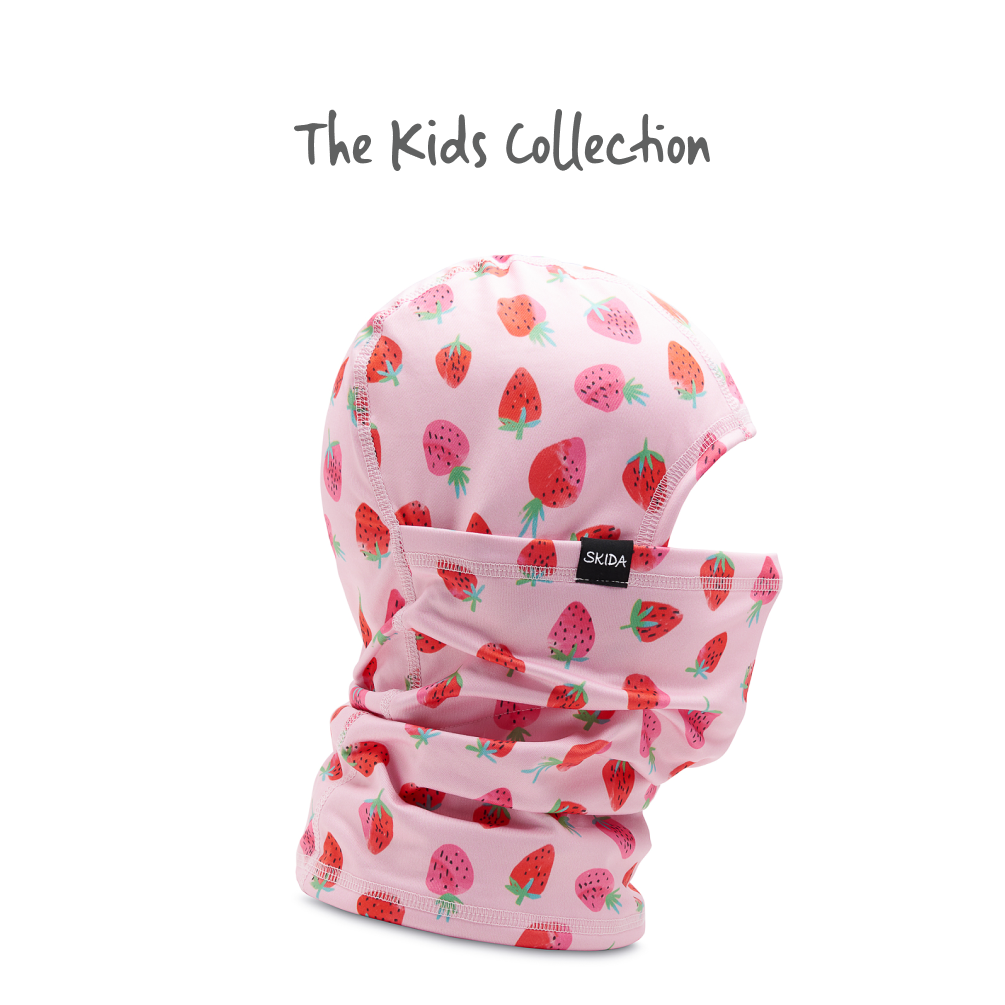 Kids balaclava with strawberry print pattern on pink fabric, shown as full hood with neck gaiter