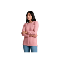 Women's crew neck tunic sweater in dusty pink, front view, model with arms crossed