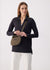 Olive green crossbody bag with top handle and logo strap, worn on model