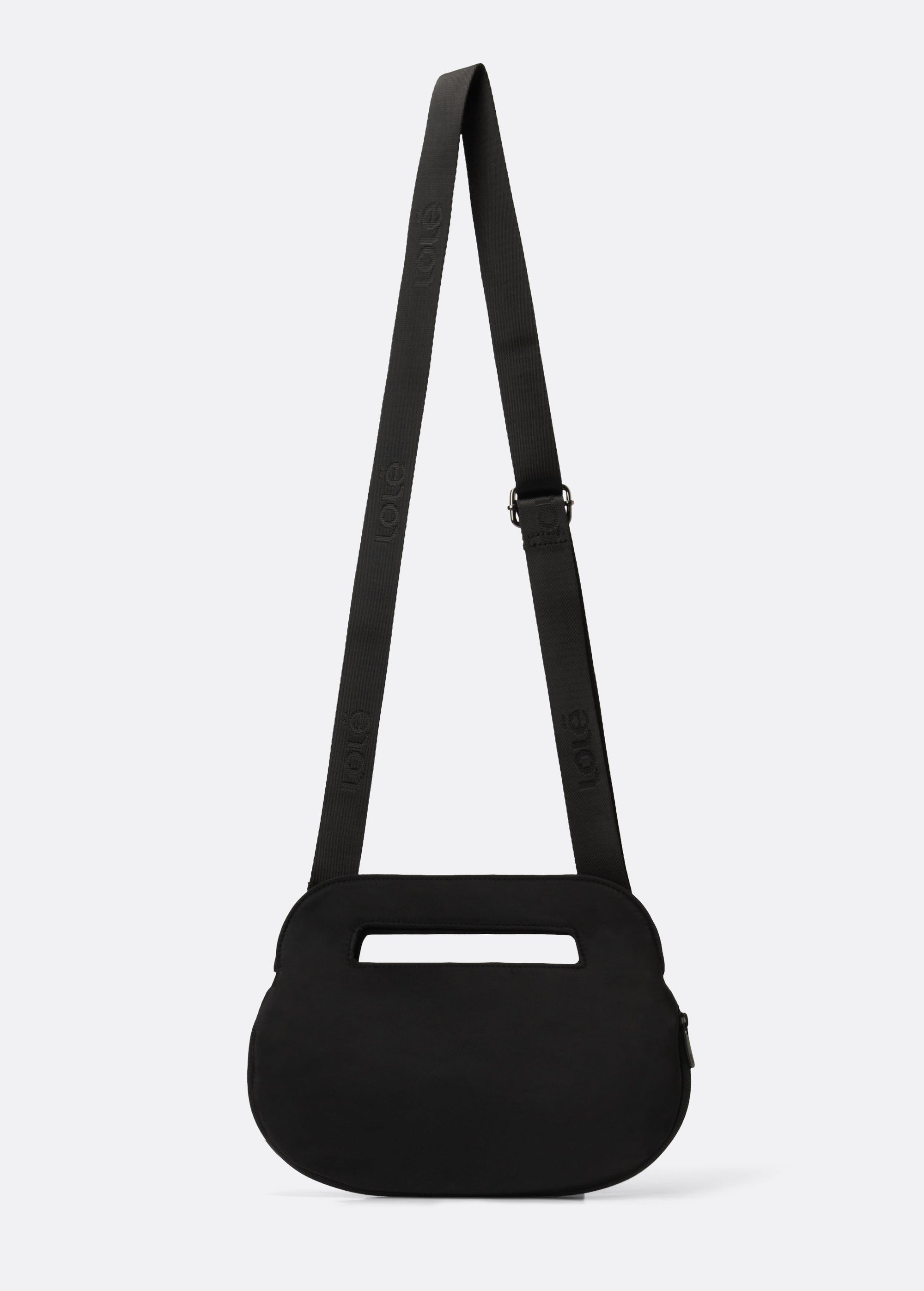 Black oval crossbody bag with adjustable logo strap and top carry handle, back view