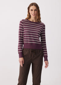 Women's striped long sleeve pullover in purple with cream stripes, front view on model