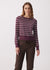 Women's striped long sleeve pullover in purple with cream stripes, front view on model