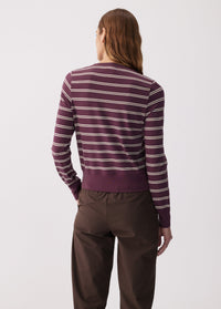 Women's striped long sleeve top in dark purple with cream stripes, back view on model