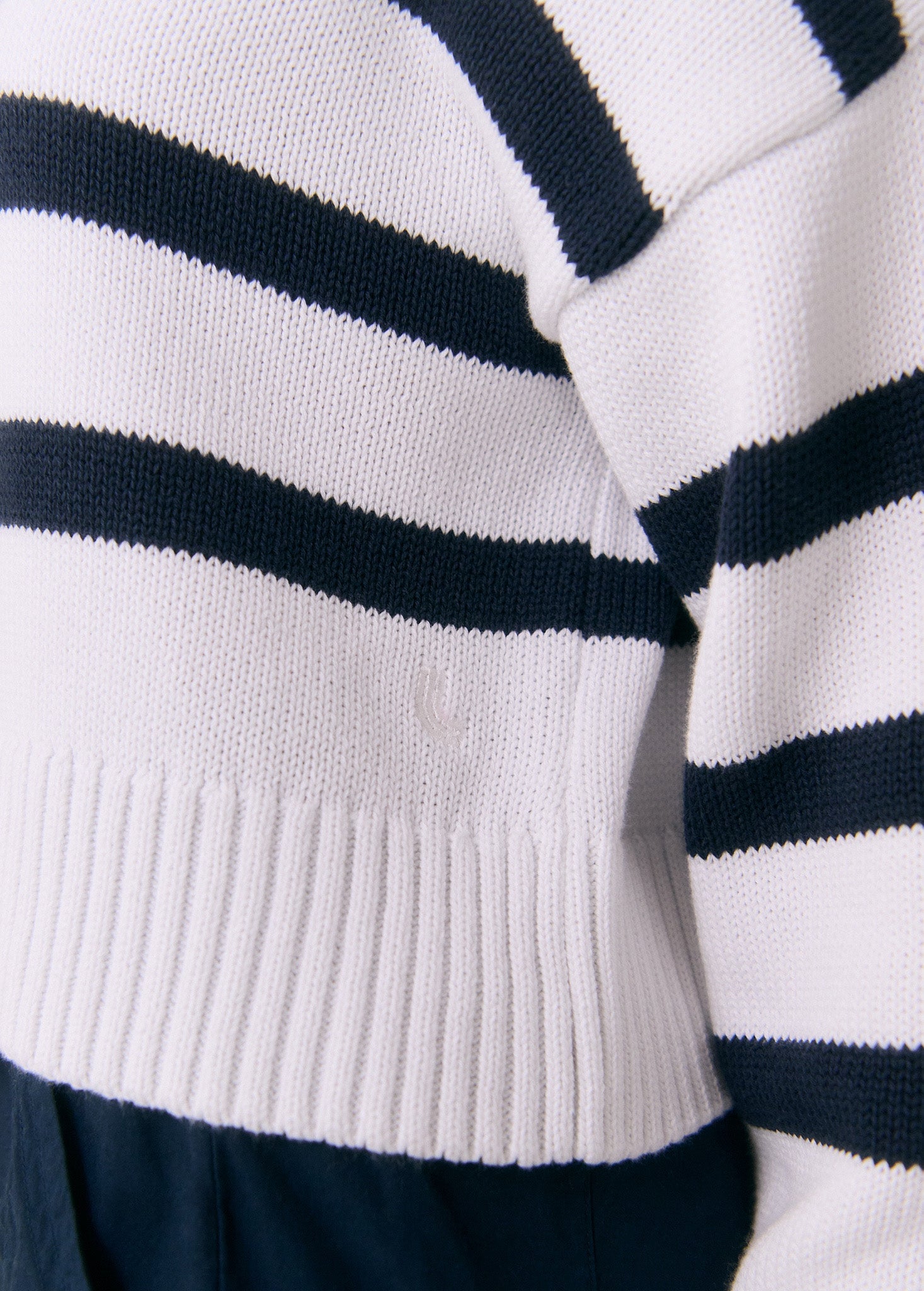 Striped knit polo sweater with ribbed hem and cuffs in white and navy