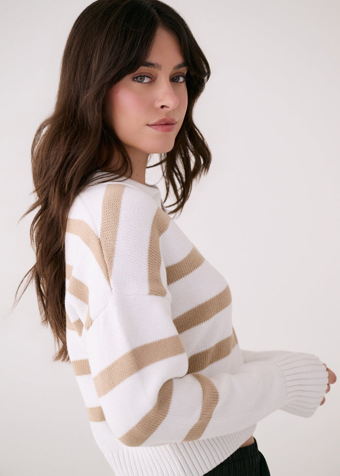 White striped knit sweater with ribbed cuffs and hem, three-quarter view