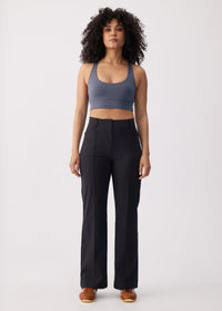 Women's high-waist wide-leg black travel trousers with front seam detail, front view