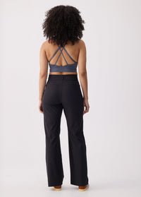 Black wide-leg travel trousers, back view on model with high waistband