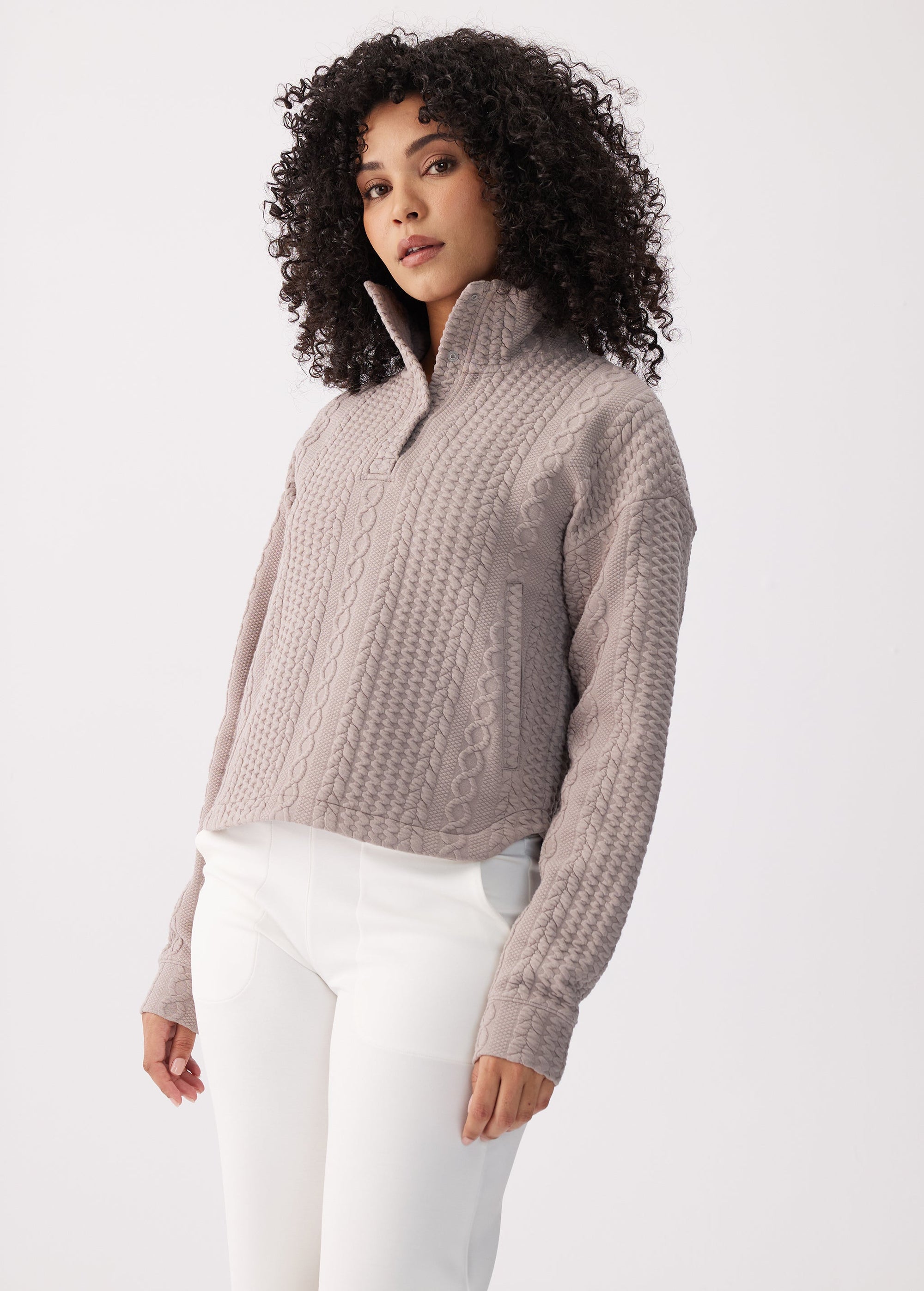 Women's cable-knit quarter-zip pullover top with mock neck, long sleeves, front view