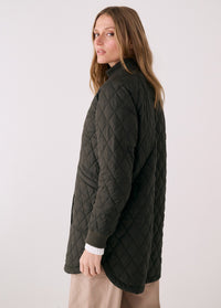 Women's quilted 3/4 length bomber jacket in dark olive, side view on model