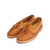 Brown leather woven loafers with tassels and white contrast stitching on white background