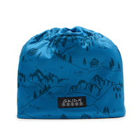 Teal blue winter beanie hat with mountain landscape print, flat lay view