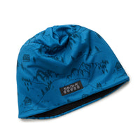 Blue beanie hat with mountain landscape print, featuring trees, peaks, and cabin illustrations