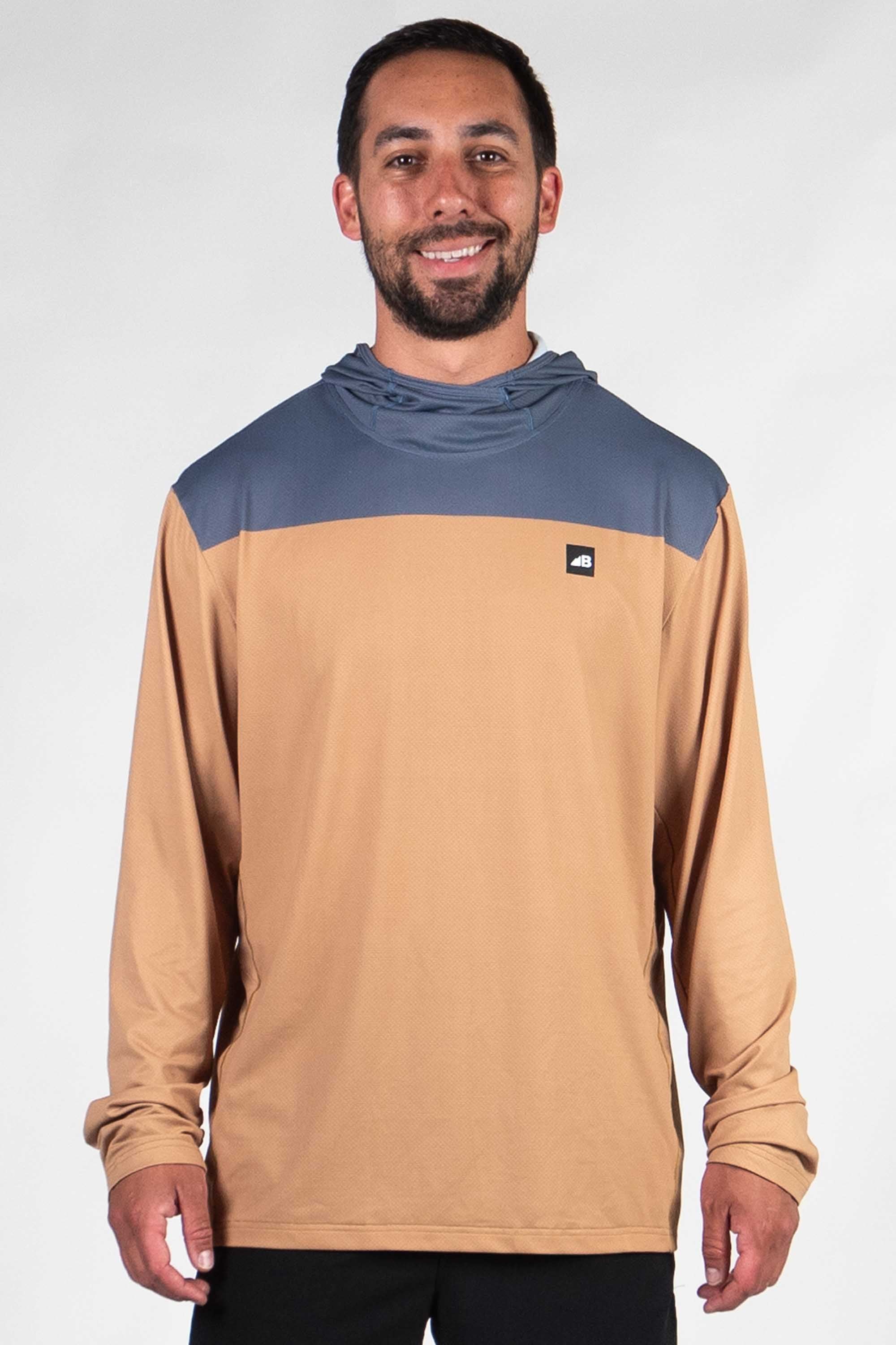 Men's hooded long sleeve shirt with blue chest panel and tan body, front view