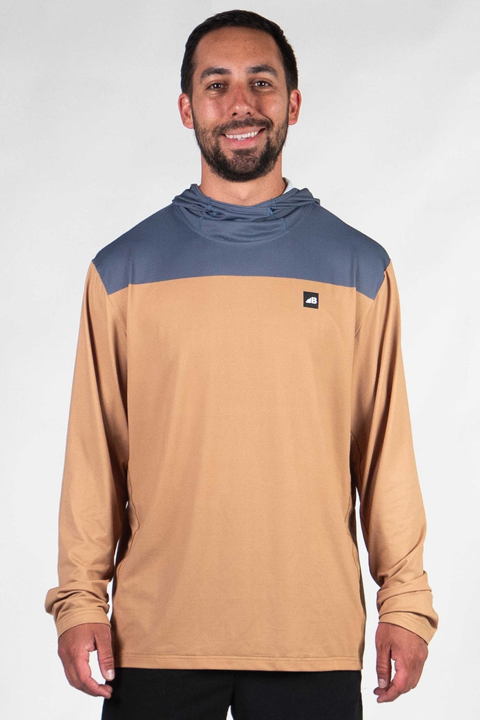 Men's hooded long sleeve shirt with blue chest panel and tan body, front view