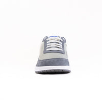Gray and beige lace-up sneaker with textured panels, front toe view on white background