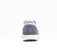 Gray suede sneaker with white sole and heel counter, rear view