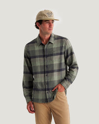 Men's long-sleeve plaid flannel shirt in green and navy, button-front with chest pocket, front view