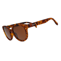 Round oversized tortoiseshell sunglasses with brown lenses, angled three-quarter view