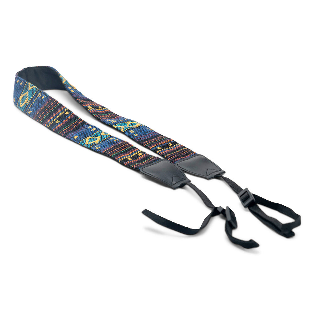 Woven tapestry camera strap with colorful geometric pattern and black leather ends and buckle clips