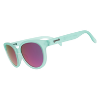 Round oversized sunglasses with mint green translucent frames and pink mirrored lenses, angled view