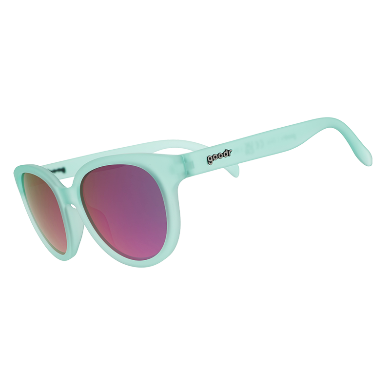 Round oversized sunglasses with mint green translucent frames and pink mirrored lenses, angled view