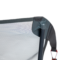 Gray reclining camping chair showing adjustable headrest and armrest detail