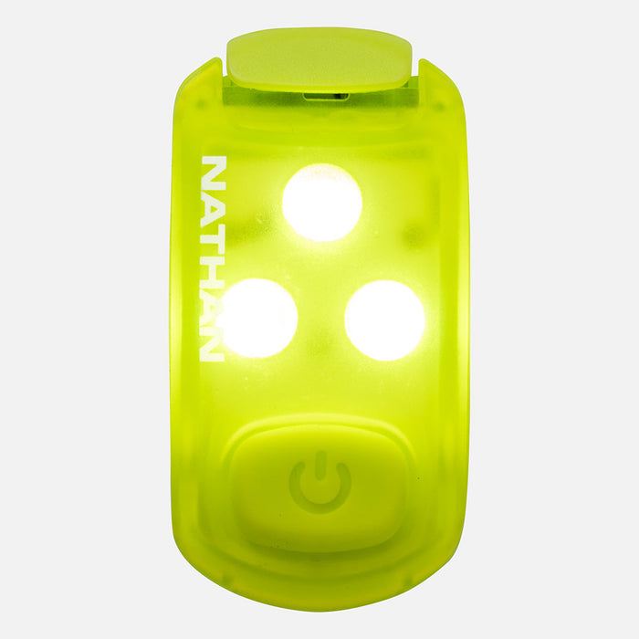 Bright green LED safety light clip with three illuminated white lights and power button